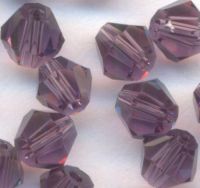  Toupies en crystal 4 mm
dark diamond
X 100 
