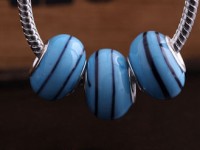 Perles Lampwork , perles de Murano et argent
Mixte turquoise    15 x 9 et trou 4.5mm
X 10  