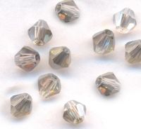 Toupies en crystal 4mm 
X 100